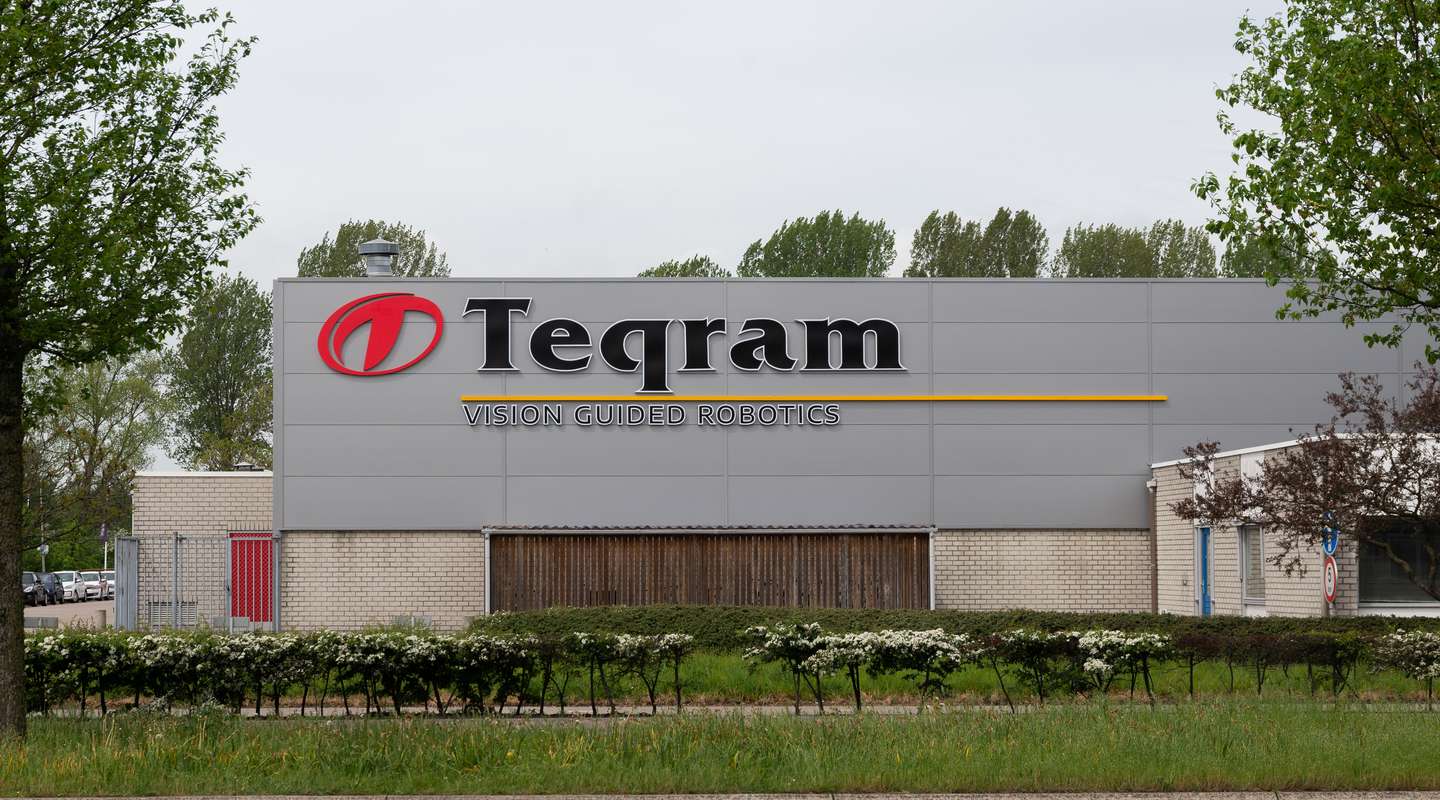 Outside view on the Teqram Building with the logo on the building