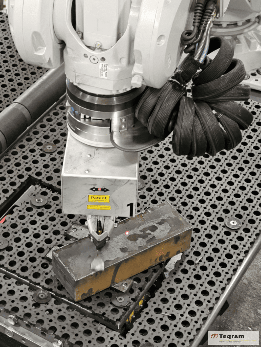 EasyGrinder tool head removing slag from heavy plate component at AMP