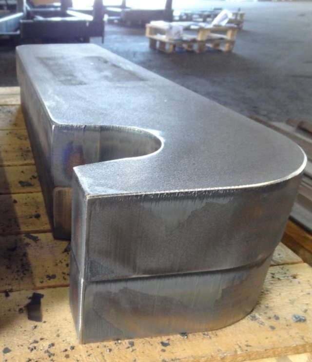 2 Heavy oxy-fuel cut steel products with grinded edges on a pallet